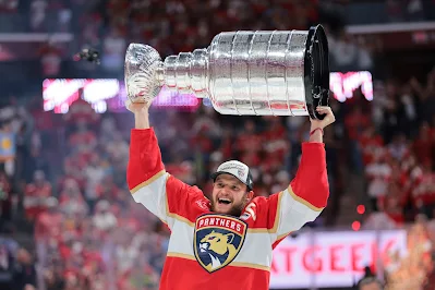 Florida Panthers captain Aleksander Barkov raises the Stanley Cup