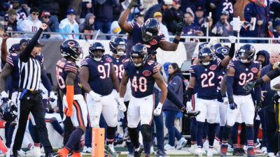 Nov 23, 2025; Chicago, Illinois, USA; Chicago Bears linebacker Amen Ogbongbemiga (45) and linebacker D'Marco Jackson (48) react after a defensive stop during the second half at Soldier Field.