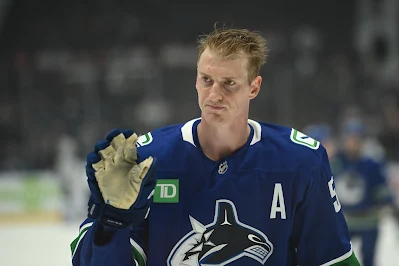 Vancouver Canucks defenceman Tyler Myers waves to fans