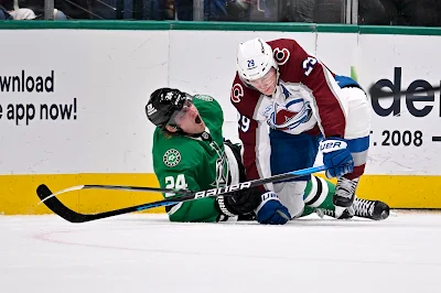 Dallas Stars center Roope Hintz howls in pain on the ice
