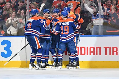 Edmonton Oilers forward Trent Frederic celebrates a goal with teammates