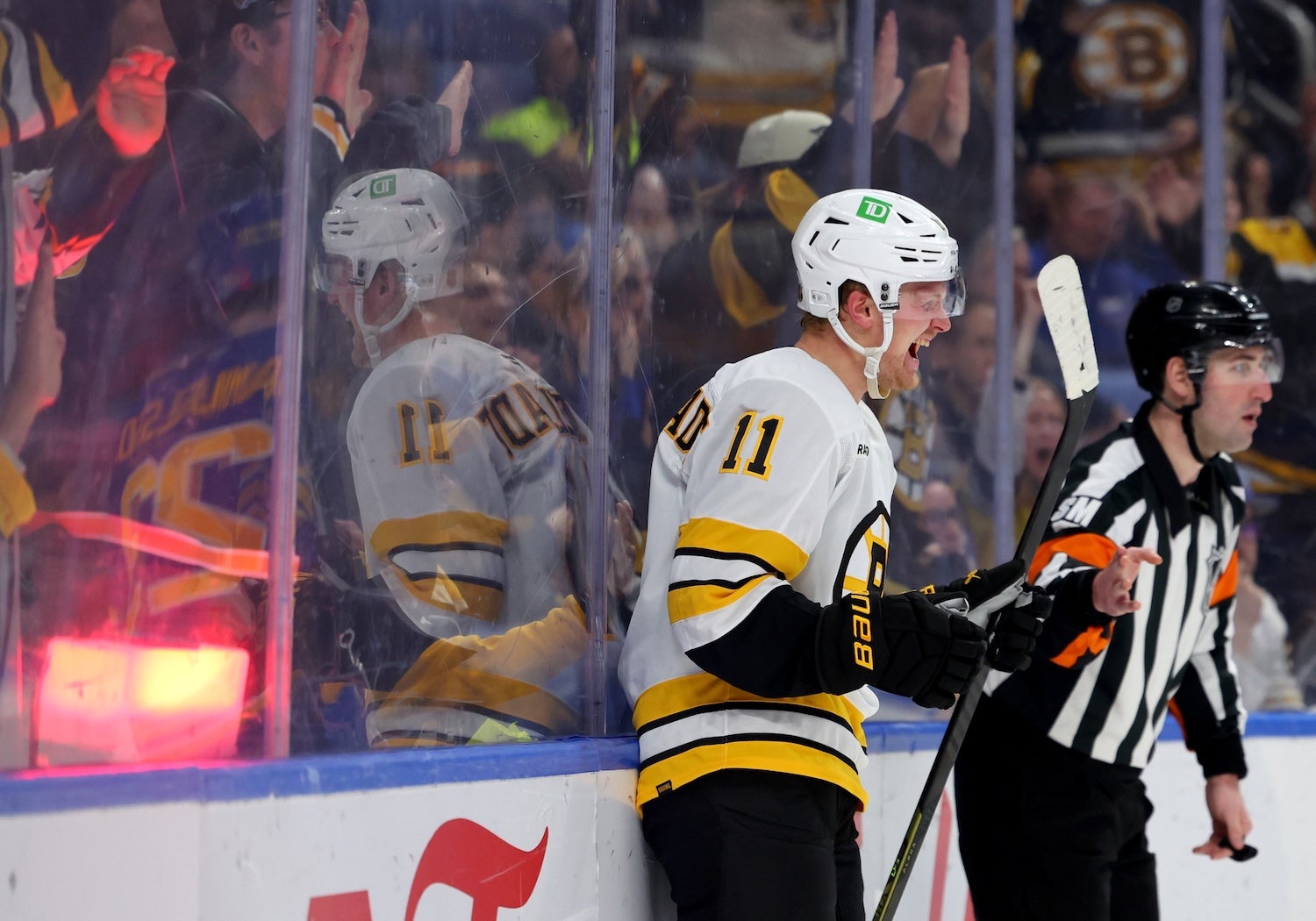 Mar 25, 2026; Buffalo, New York, USA;  Boston Bruins center Casey Mittelstadt (11) reacts after scoring a goal during the third period against the Buffalo Sabres at KeyBank Center. Mandatory Credit: Timothy T. Ludwig-Imagn Images
