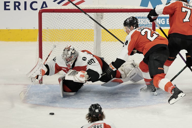 Flyers goaltender Dan Vladar dives on a loose puck in the second period of the Philadelphia Flyers vs. Boston Bruins NHL game at Xfinity Mobile Arena in Philadelphia on Saturday, Feb. 28, 2026