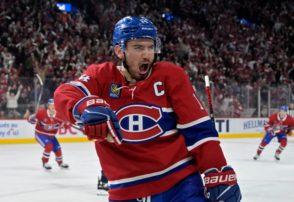 Montreal Canadiens forward Nick Suzuki (14) celebrates after scoring a goal against the Washington Capitals at the Bell Centre.Eric Bolte-Imagn Images