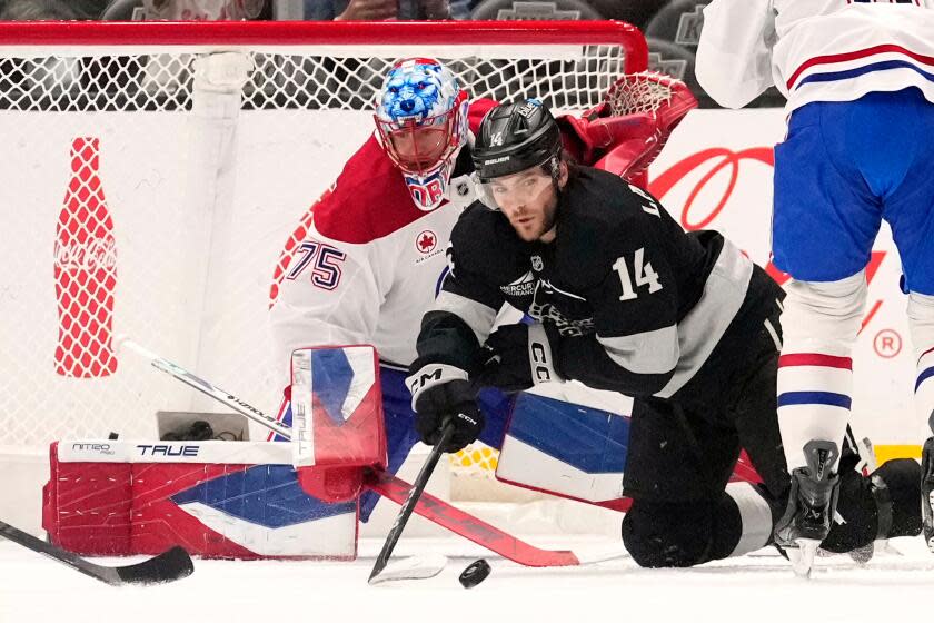 Los Angeles Kings right wing Alex Laferriere, right, passes the puck as Montréal Canadiens.