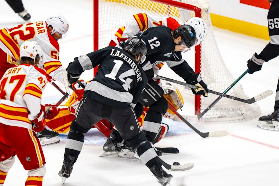 Los Angeles Kings right wing Alex Laferriere (14) successfully making a shot on goal during an NHL hockey game against the Calgary Flames on February 26th, 2026 in Los Angeles, CA.