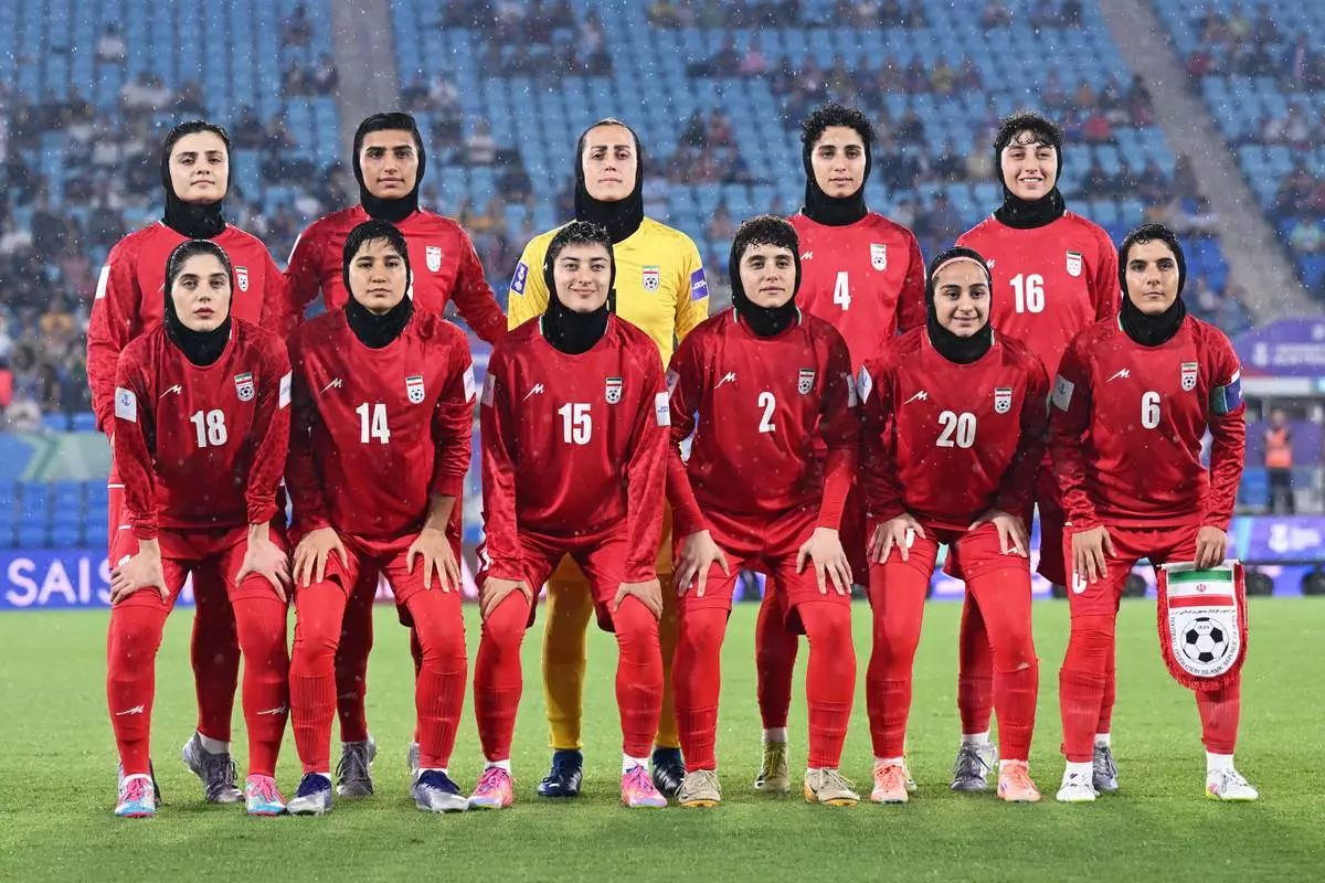 FILE - Iran players pose for a team photo ahead of the Women's Asian Cup soccer match between Iran and the Philippines in Robina, Australia, Sunday, March 8, 2026. (Dave Hunt/AAPImage via AP,File)