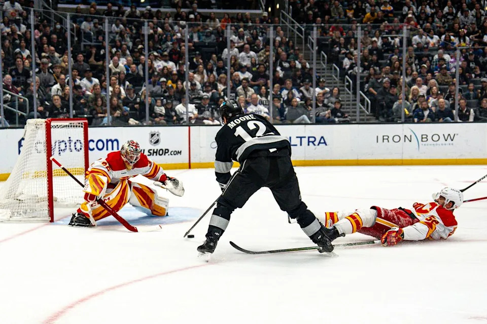 Los Angeles Kings left wing Trevor Moore (12) unsuccessfully taking a shot at goal during an NHL hockey game against the Calgary Flames on February 26th, 2026 in Los Angeles, CA.