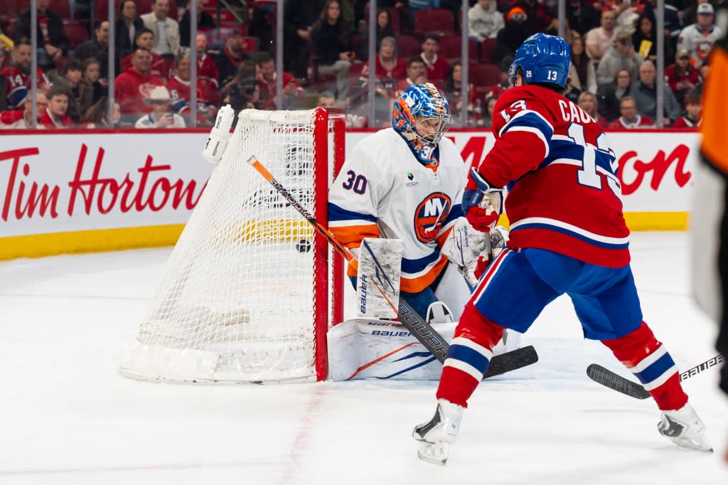 Cole Caufield (13) scores on Ilya Sorokin during the second period for the first of his three goals in the Islanders’ 7-3 blowout loss to the Canadiens on March 21, 2026 in Montreal. NHLI via Getty Images