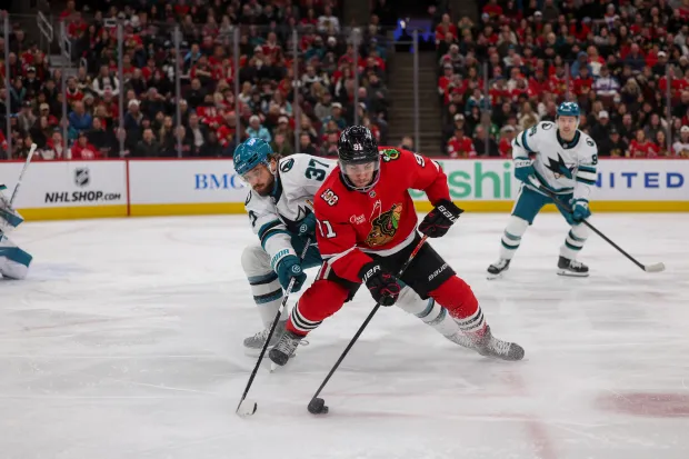 San Jose Sharks defenseman Timothy Liljegren (37) guards Chicago Blackhawks center Frank Nazar (91) while he handles the puck during the first period at the United Center Monday Feb. 2, 2026 in Chicago. (Armando L. Sanchez/Chicago Tribune)