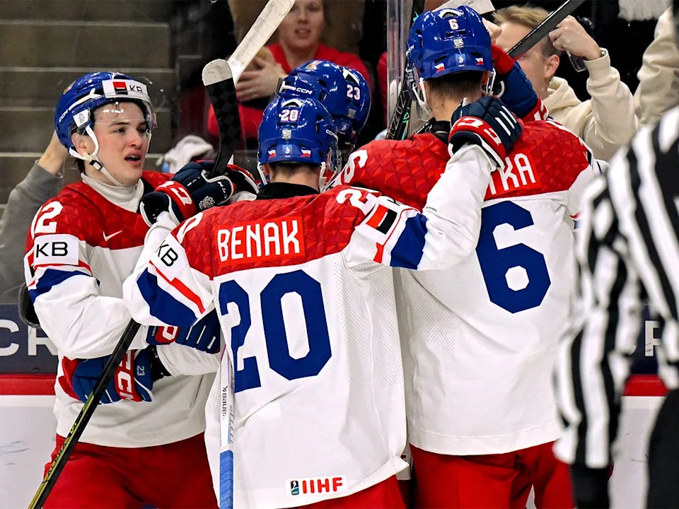  Max Curran #12 of Czechia celebrates his goal against Canada with Adam Benak #20 and Radim Mrtka #6 in the first period of a semifinal game during the IIHF World Junior Hockey Championship at Grand Casino Arena on Jan. 4, 2026 in St. Paul, Minnesota.