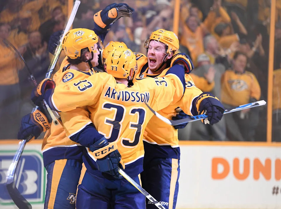Apr 12, 2018; Nashville, TN, USA; Nashville Predators center Ryan Johansen (92) Nashville Predators left wing Viktor Arvidsson (33) Nashville Predators left wing Filip Forsberg (9) and Nashville Predators right wing Craig Smith (15) celebrate after a power play goal during the second period against the Colorado Avalanche in game one of the first round of the 2018 Stanley Cup Playoffs at Bridgestone Arena. Mandatory Credit: Christopher Hanewinckel-Imagn Images