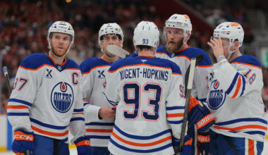 Edmonton Oilers defenseman Mattias Ekholm (14) talks to center Connor McDavid (97), defenseman Evan Bouchard (2), center Ryan Nugent-Hopkins (93) and left wing Zach Hyman (18) during the first period at Amerant Bank Arena