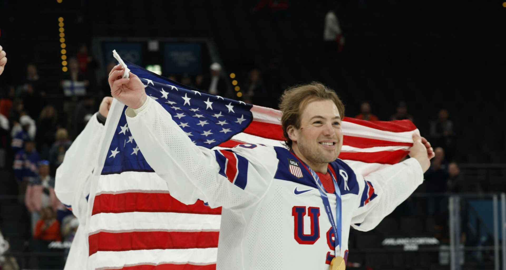Charlie McAvoy (25) of Team United States celebrates after the medal ceremony