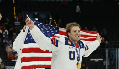 Charlie McAvoy (25) of Team United States celebrates after the medal ceremony