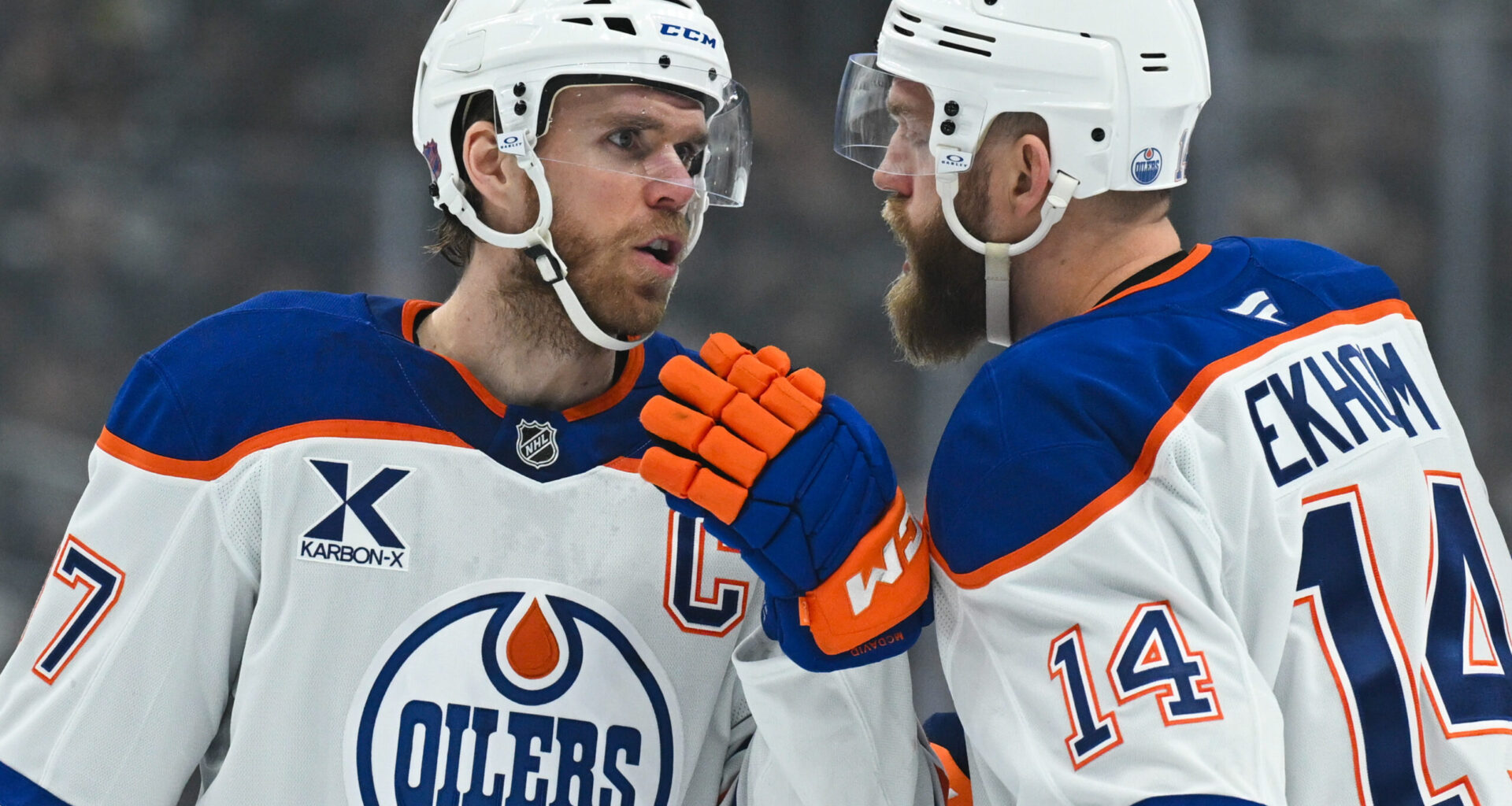 Edmonton Oilers center Connor McDavid (97) talks to defenseman Mattias Ekholm