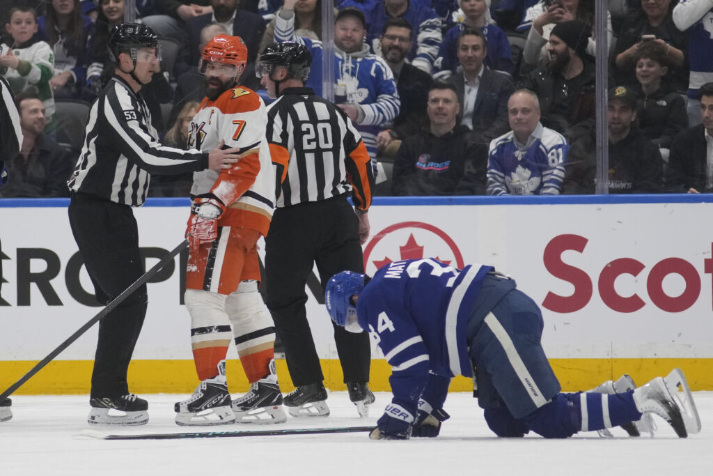 Anaheim Ducks defenseman Radko Gudas (7) looks at an injured Toronto Maple Leafs forward Auston Matthews