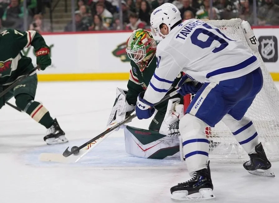  Minnesota Wild goaltender Jesper Wallstedt blocks a shot by Toronto Maple Leafs center John Tavares, right, during the second period of an NHL hockey game, Sunday, March 15, 2026, in St. Paul, Minn.