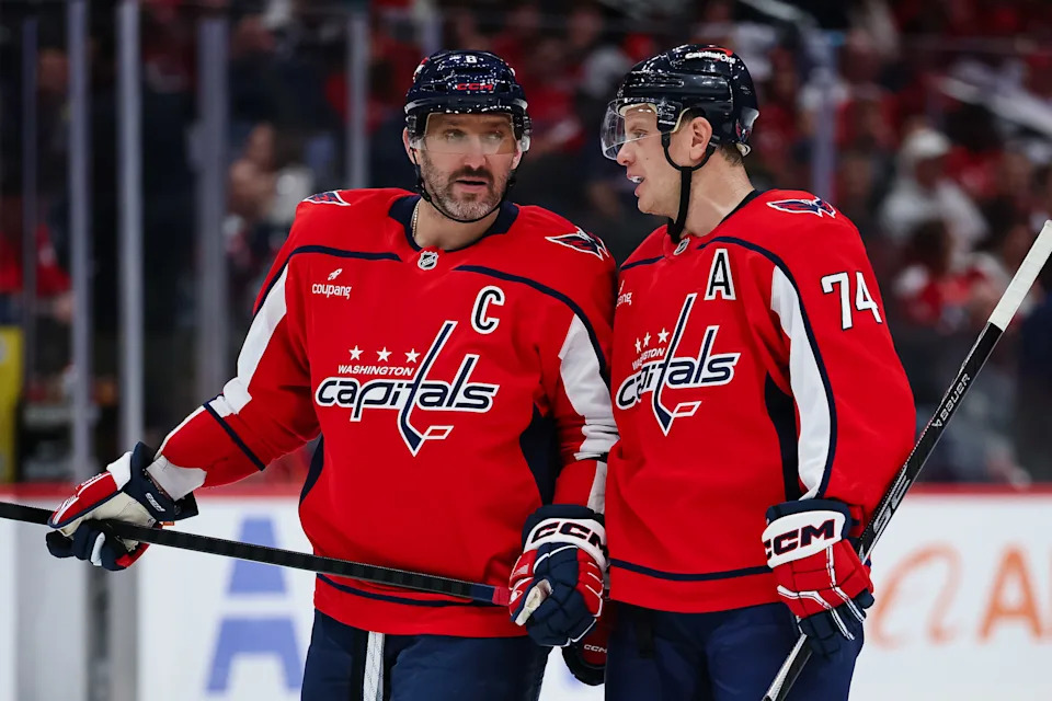 WASHINGTON, DC - OCTOBER 31: Alex Ovechkin #8 of the Washington Capitals speaks with John Carlson #74 during the second period of the game against the New York Islanders at Capital One Arena on October 31, 2025 in Washington, DC. (Photo by Scott Taetsch/Getty Images)