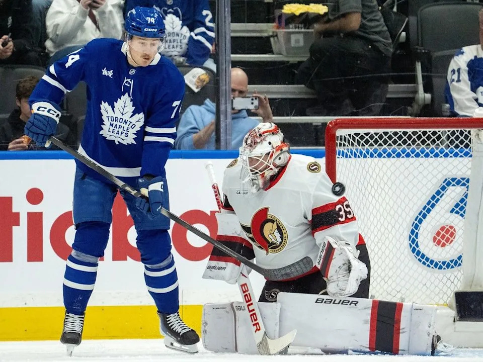  Ottawa Senators goaltender Linus Ullmark makes a save as Toronto Maple Leafs centre Bobby McMann looks on during the first period in Toronto on Saturday, Feb. 28, 2026.