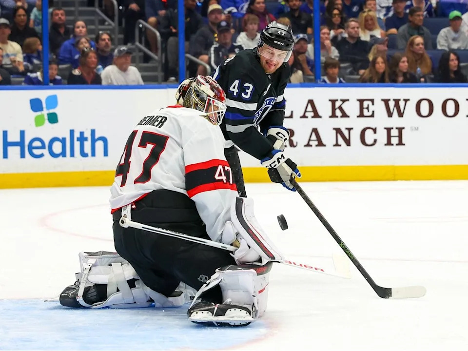  James Reimer of the Ottawa Senators makes a save against Darren Raddysh of the Lightning during the second period on March 28, 2026 in Tampa.