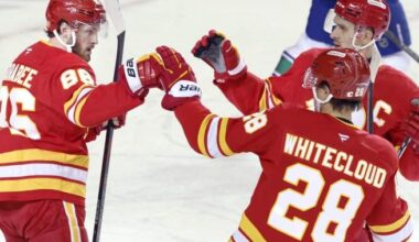 Flames ignite offence, burn Canucks 7-3