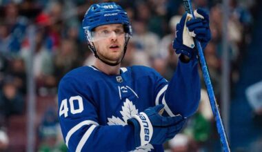 A jersey swap photo illustration of Elias Pettersson wearing a Toronto Maple Leafs home uniform, visually representing the rumored blockbuster trade from the Vancouver Canucks.