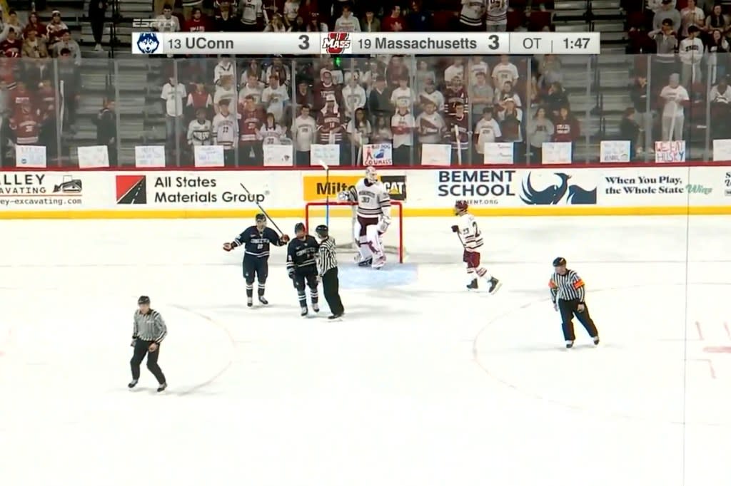UConn players react after play was stopped in overtime of their game against UMass. Screengrab via X/@BR_OpenIce