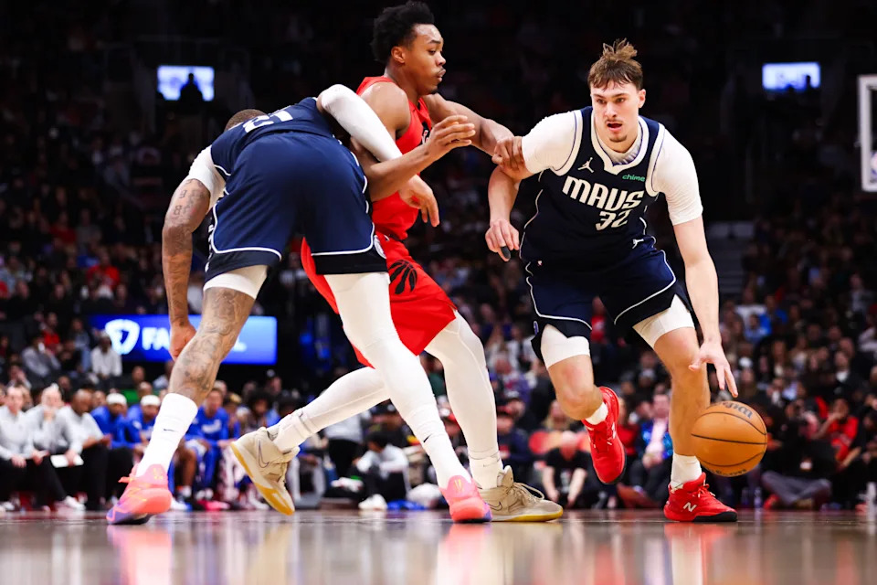 TORONTO, CANADA - MARCH 8: Cooper Flagg #32 of the Dallas Mavericks drives against Scottie Barnes #4 of the Toronto Raptors during the second half of their NBA game at Scotiabank Arena on March 8, 2026 in Toronto, Ontario, Canada. NOTE TO USER: User expressly acknowledges and agrees that, by downloading and or using this photograph, User is consenting to the terms and conditions of the Getty Images License Agreement. (Photo by Cole Burston/Getty Images)
