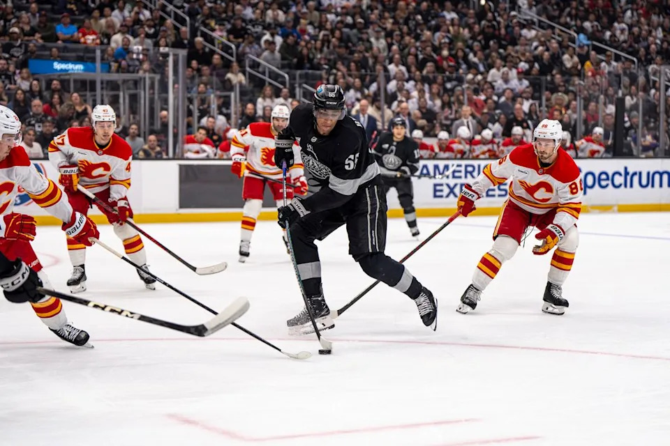Los Angeles Kings right wing Quinton Byfield (55) keeping the puck away from Calgary during an NHL hockey game against the Calgary Flames on February 26th, 2026 in Los Angeles, CA.