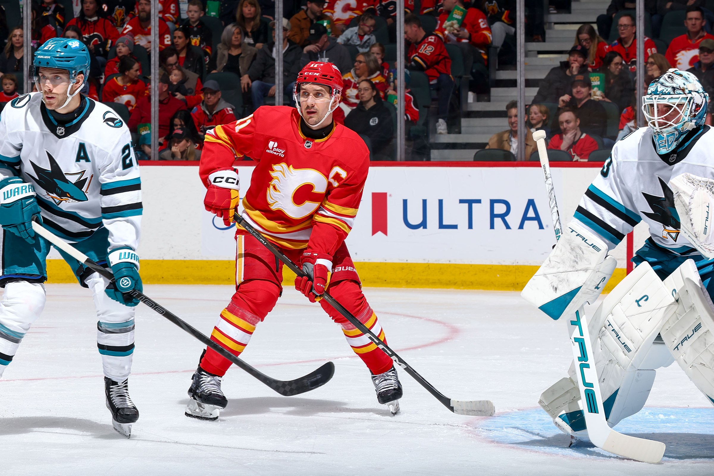 CALGARY, CANADA- JANUARY 31: Mikael Backlund #11 of the Calgary Flames awaits a pass in front of the net against Alexander Wennberg #21 of the San Jose Sharks at Scotiabank Saddledome on January 31, 2026 in Calgary, Alberta, Canada. (Photo by Gerry Thomas/NHLI via Getty Images)