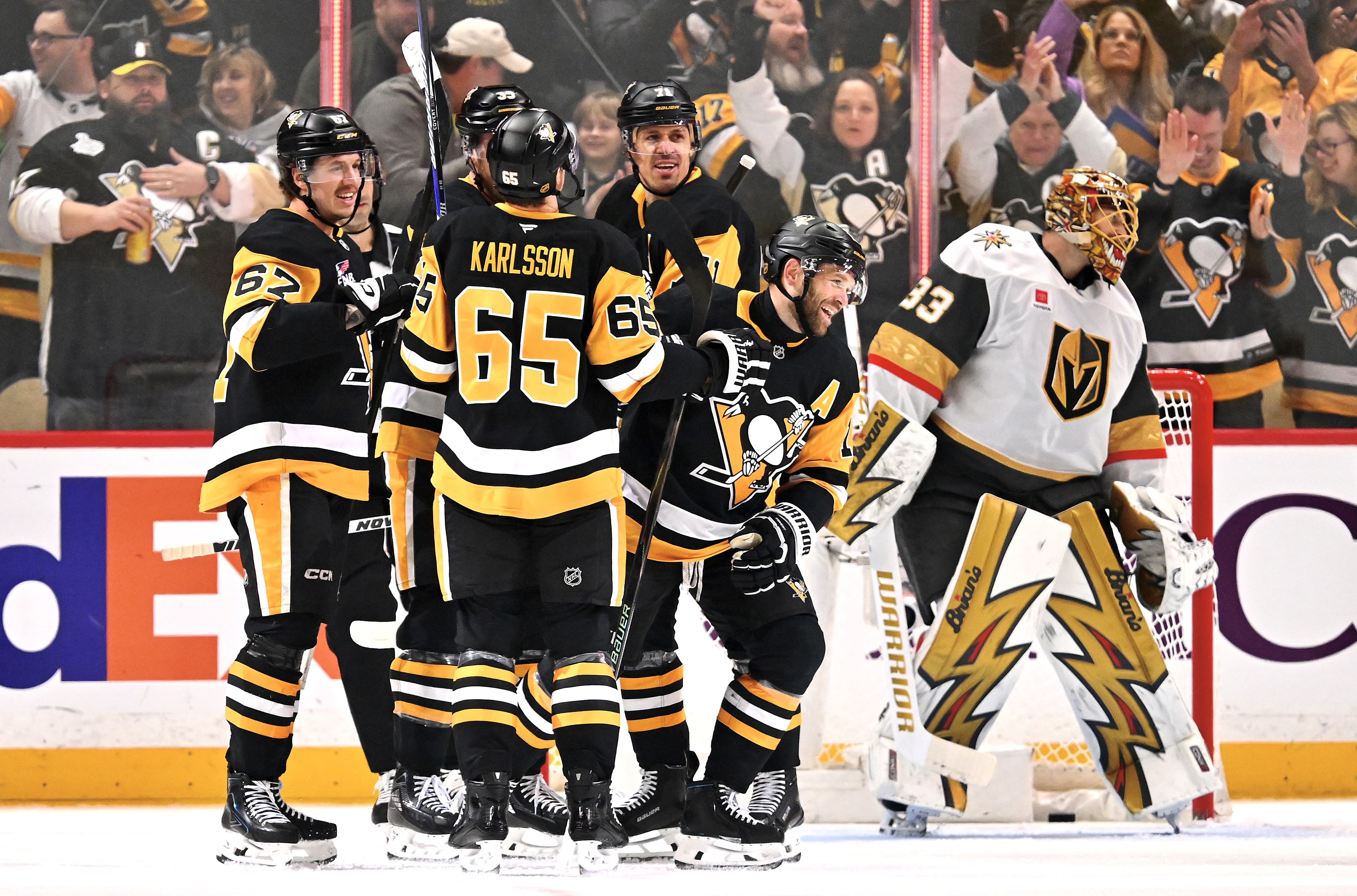 The Penguins celebrate Bryan Rust's power-play goal.