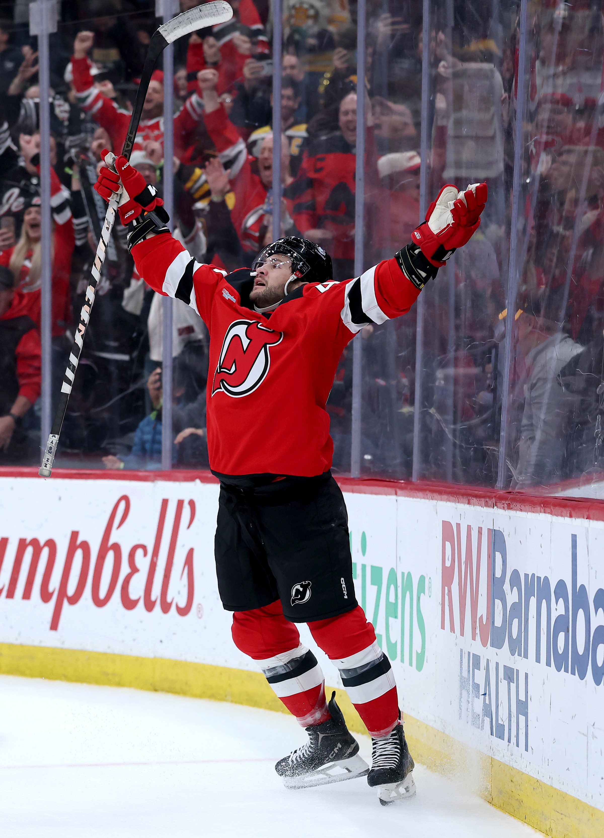 NEWARK, NEW JERSEY - MARCH 16: Paul Cotter #47 of the New Jersey Devils celebrates his game winning goal during the overtime period against the Boston Bruins at Prudential Center on March 16, 2026 in Newark, New Jersey. The New Jersey Devils defeated the Boston Bruins 4-3 in overtime. (Photo by Elsa/Getty Images)