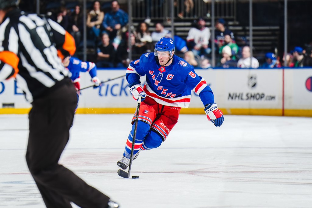 J.T. Miller of the New York Rangers skates with the puck at Madison Square Garden.