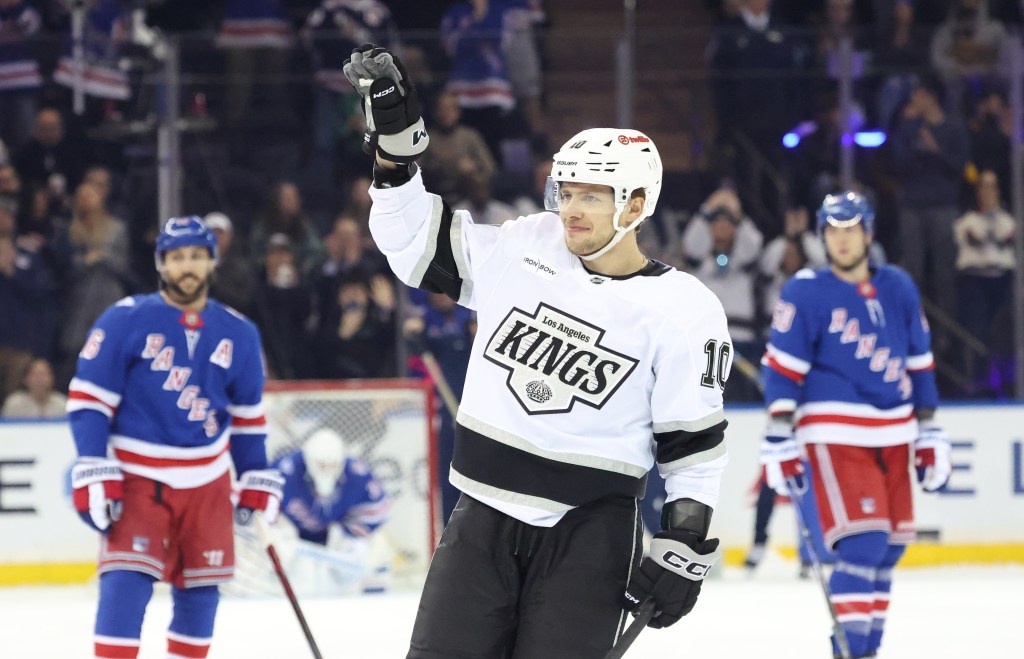 Los Angeles Kings player Artemi Panarin waving to fans during a game against the New York Rangers.
