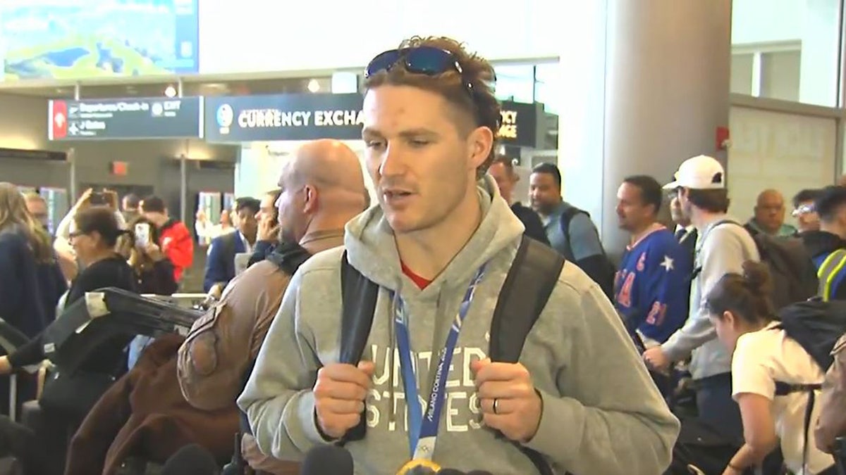 Team USA men's hockey player Matthew Tkachuk speaks with the media after arriving at Miami International Airport, Monday, Feb., 23, 2026, a day after the U.S. team clinched its first Olympic gold medal in 46 years on Sunday in Italy.