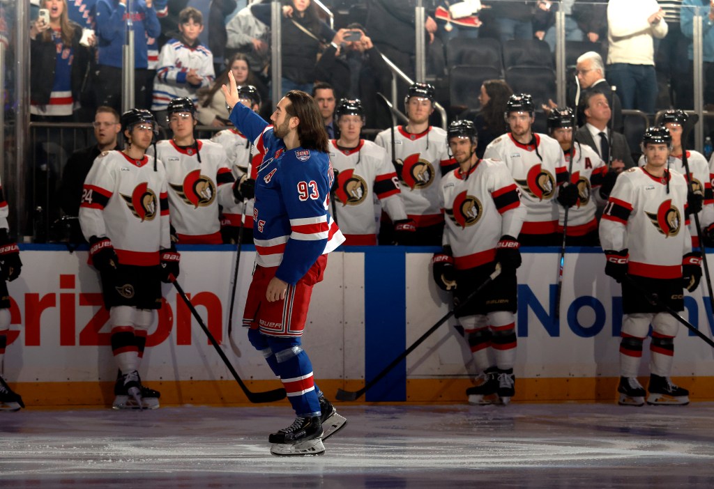 New York Rangers player Mika Zibanejad waves to the fans after being honored for his 1000th career game.