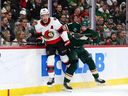 Danila Yurov of the Wild checks Jake Sanderson of the Senators during a game on Dec. 13, 2025.