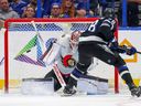 The Lightning's Emil Lilleberg scores what proves to be the winning goal against the Senators' James Reimer during the third period of Saturday's game in Tampa, Florida.