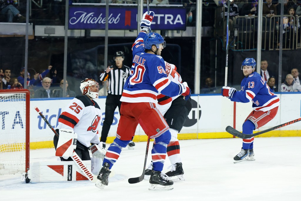 New York Rangers left wing Will Cuylle (50) reacts after defenseman Vladislav Gavrikov (44) scores a goal past New Jersey Devils goaltender Jacob Markstrom (25).