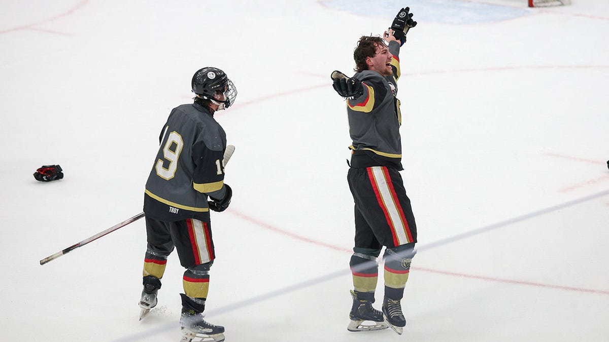 Colin Dorgan with his teammate