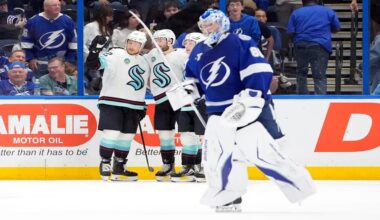 Seattle Kraken defenseman Brandon Montour, right, celebrates after scoring against Tampa Bay Lightning goaltender Andrei Vasilevskiy (88) during overtime of an NHL hockey game Thursday, March 26, 2026, in Tampa, Fla. (AP Photo/Chris O'Meara)