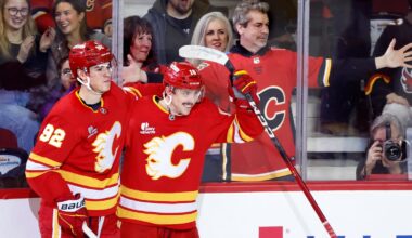 Flames ignite their offense, burn Canucks 7-3