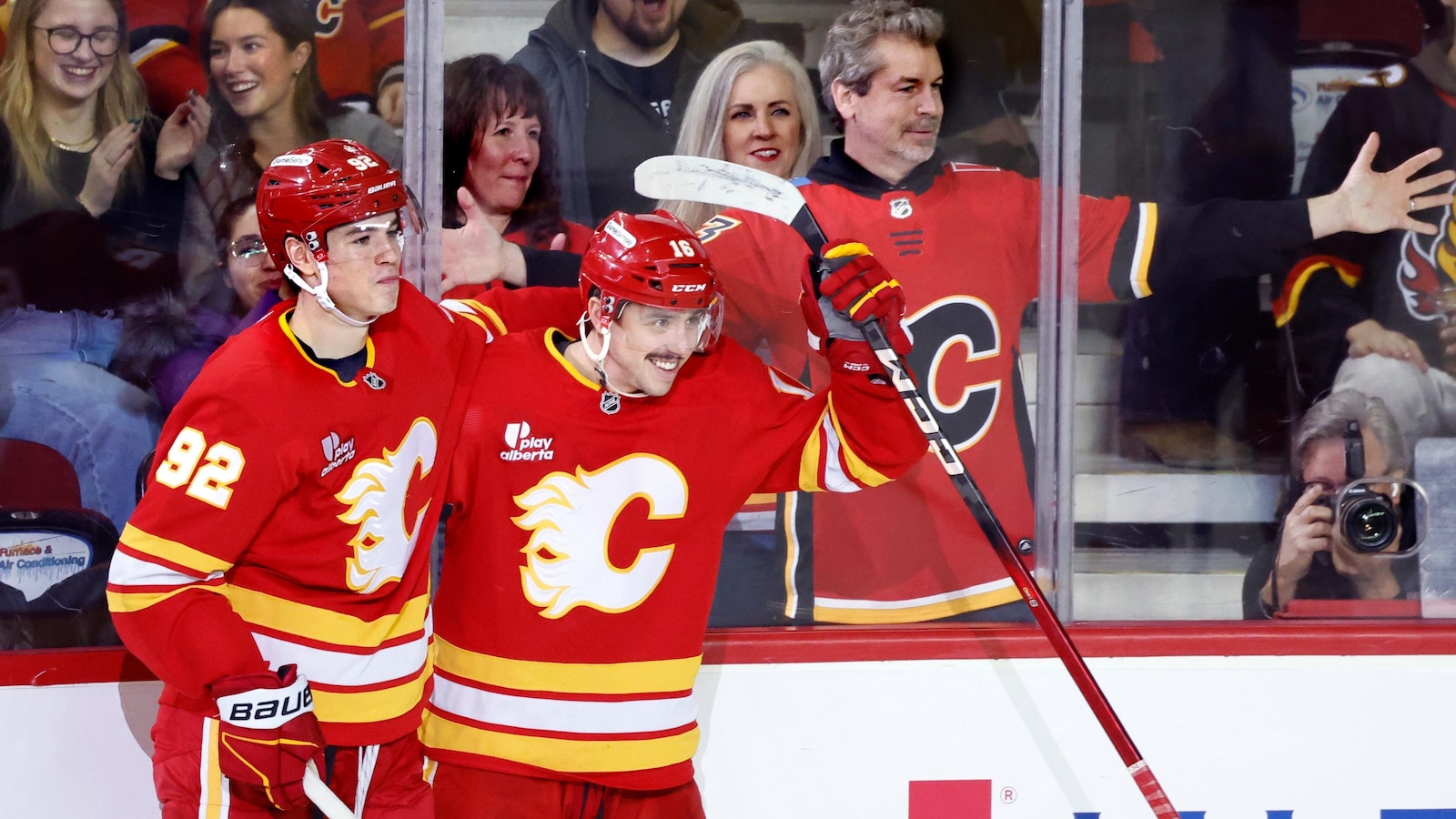Flames ignite their offense, burn Canucks 7-3
