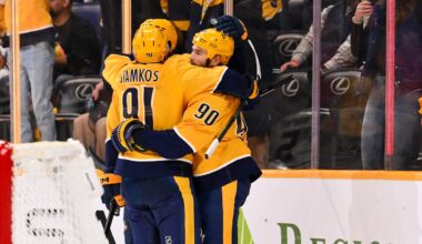Feb 26, 2026; Nashville, Tennessee, USA;  Nashville Predators center Ryan O'Reilly (90) celebrates his goal with center Steven Stamkos (91) and defenseman Roman Josi (59) against the Chicago Blackhawks during the third period at Bridgestone Arena. Mandatory Credit: Steve Roberts-Imagn Images