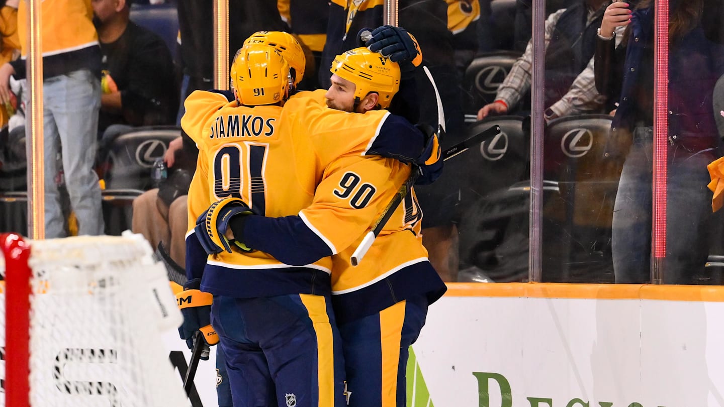 Feb 26, 2026; Nashville, Tennessee, USA;  Nashville Predators center Ryan O'Reilly (90) celebrates his goal with center Steven Stamkos (91) and defenseman Roman Josi (59) against the Chicago Blackhawks during the third period at Bridgestone Arena. Mandatory Credit: Steve Roberts-Imagn Images