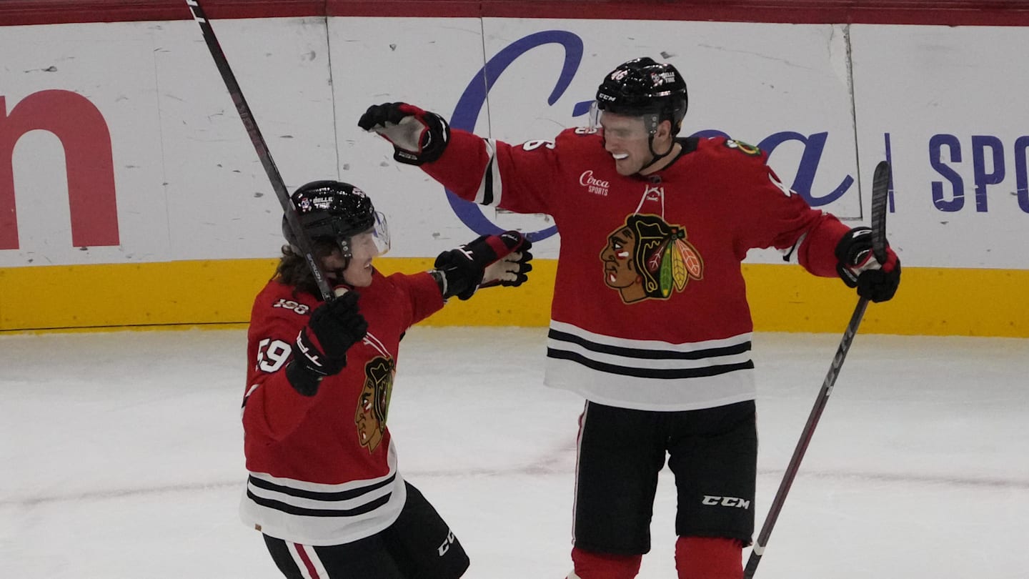 Oct 28, 2025; Chicago, Illinois, USA; Chicago Blackhawks defenseman Louis Crevier (46) celebrates his goal against the Ottawa Senators with Chicago Blackhawks left wing Tyler Bertuzzi (59) during the first period at United Center. Mandatory Credit: David Banks-Imagn Images