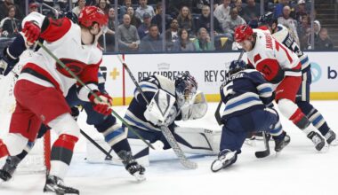 Mar 31, 2026; Columbus, Ohio, USA; Columbus Blue Jackets goalie Jet Greaves (73) makes a save as Carolina Hurricanes center Mark Jankowski (77) looks for a rebound during the first period at Nationwide Arena. Mandatory Credit: Russell LaBounty-Imagn Images