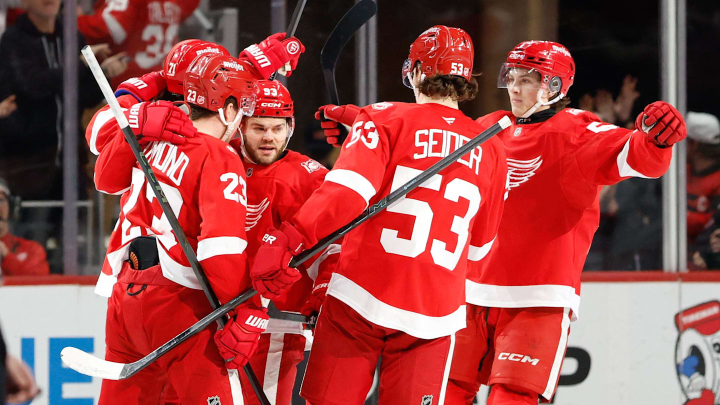 Mar 24, 2026; Detroit, Michigan, USA;  Detroit Red Wings center Dylan Larkin (71) receives congratulations from teammates after scoring in the third period against the Ottawa Senators at Little Caesars Arena. Mandatory Credit: Rick Osentoski-Imagn Images