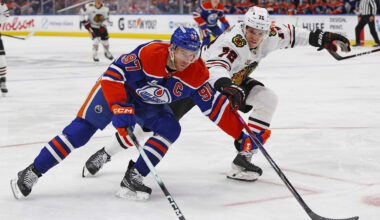 Nov 1, 2025; Edmonton, Alberta, CAN; Edmonton Oilers forward Connor McDavid (97) carries the puck around Chicago Blackhawks defensemen Alex Vlasic (72) during the third period at Rogers Place. Mandatory Credit: Perry Nelson-Imagn Images